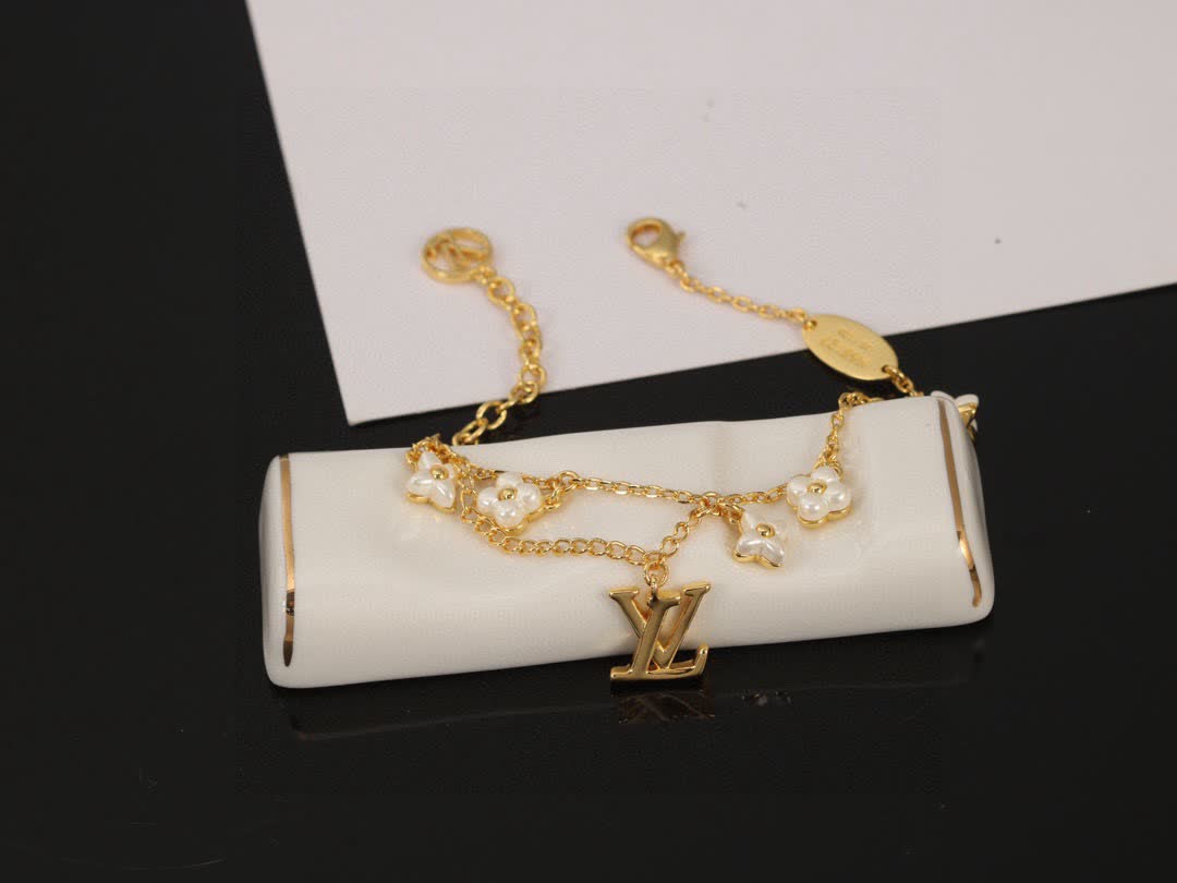 Louis Vuitton Gold Tone Bracelet with Pearls and Logo Louis Vuitton Gold Tone Bracelet with Pearls and Logo